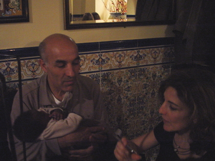 Abdelkrim Bahloul holding baby Monroe and Dr Isabel Santaolalla